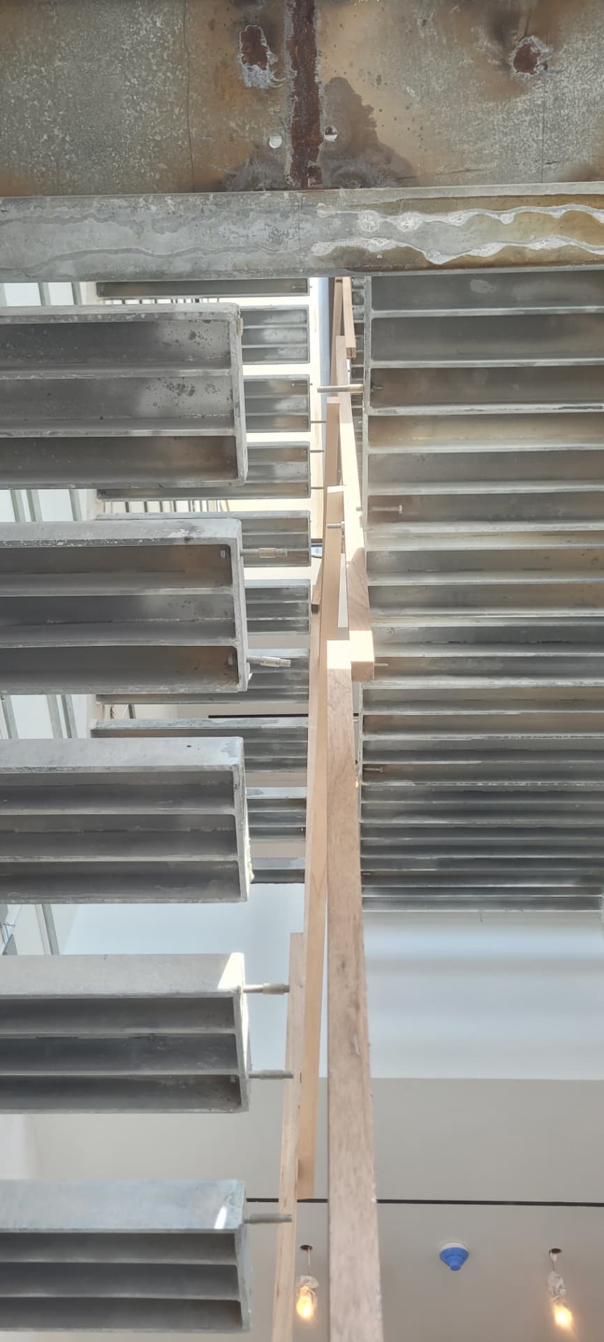Existing air grilles prepared for dedicated supply and return duct connections.