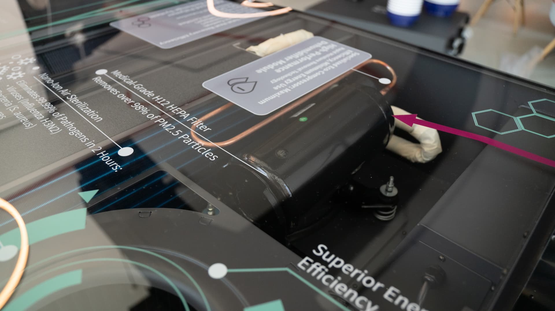 Internal view of the ONYX NOVA unit showing the compressor, coil and filtration stage.