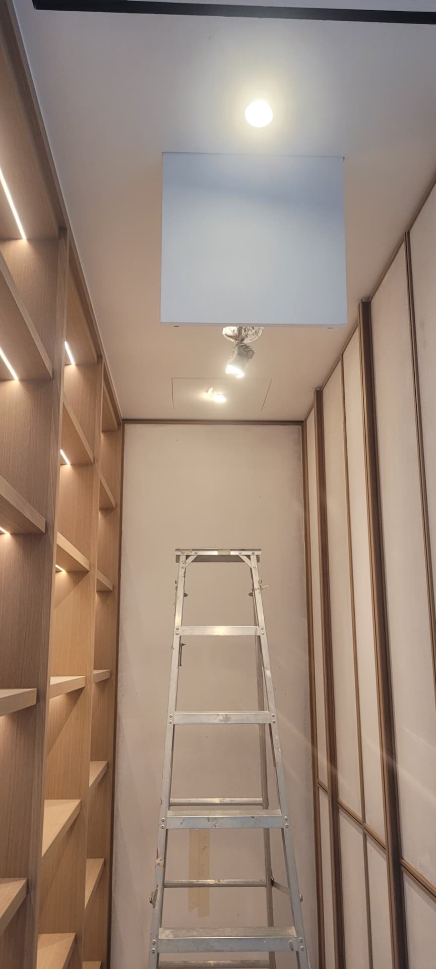 Ceiling access panel for concealed ventilation and dehumidification equipment.
