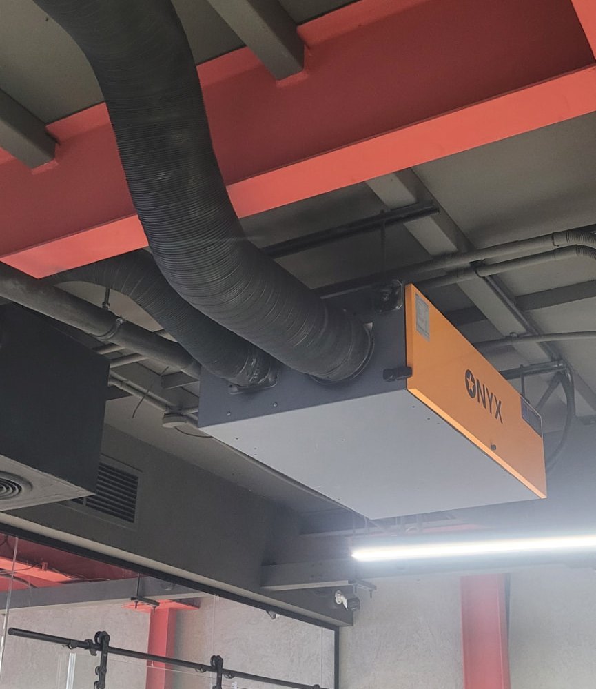ONYX ducted dehumidifier installed openly beneath the ceiling at the Goldbrew facility